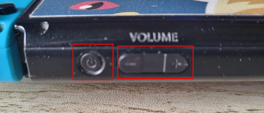 HOLD the Power, Volume Up, and Volume Down buttons simultaneously